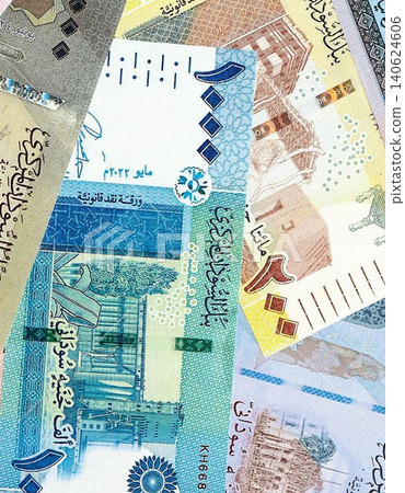 Sudanese pound paper banknotes pile on table. Sudan SDG currency money bills in big amount 140624606