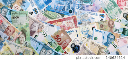 Different colorful banknotes from many various currencies of the world. Currency Exchange concept Different colorful banknotes from many various currencies of the world. Currency Exchange concept 140624614