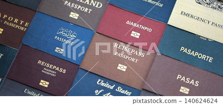 Big amount of passports of various different countries. Covers of expired passports close up Big amount of passports of various different countries. Covers of expired passports close up 140624624