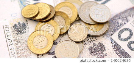 Big amount of polish zloty money banknotes and grosz coins close up. Huge pile of cash of Poland Big amount of polish zloty money banknotes and grosz coins close up. Huge pile of cash of Poland 140624625