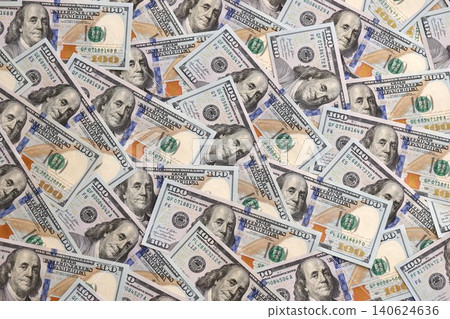 Stacks of hundred dollar bills showcase intricate designs on a flat surface Stacks of hundred dollar bills showcase intricate designs on a flat surface 140624636