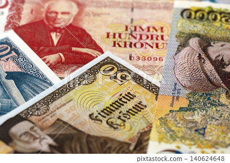 Icelandic krona money bills pile on table. Iceland banknotes of ISK currency close up Icelandic krona money bills pile on table. Iceland banknotes of ISK currency close up 140624648