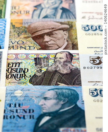 Icelandic krona money bills pile on table. Iceland banknotes of ISK currency close up Icelandic krona money bills pile on table. Iceland banknotes of ISK currency close up 140624649