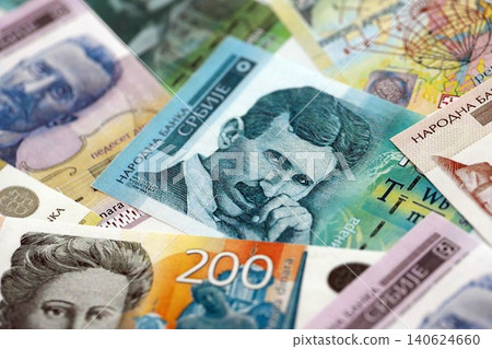 Serbian dinar money bills pile on table. Serbia banknotes of RSD currency. Concept of business Serbian dinar money bills pile on table. Serbia banknotes of RSD currency. Concept of business 140624660