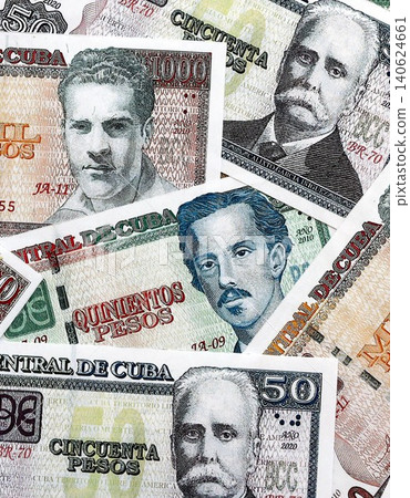Cuban peso money bills pile on table. Cuba banknotes of CUP currency close up. Concept of business Cuban peso money bills pile on table. Cuba banknotes of CUP currency close up. Concept of business 140624661