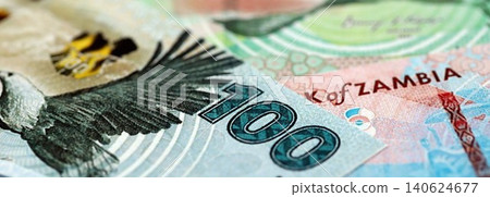 Zambian kwacha money bills pile on table. Zambia banknotes of ZMW currency close up Zambian kwacha money bills pile on table. Zambia banknotes of ZMW currency close up 140624677