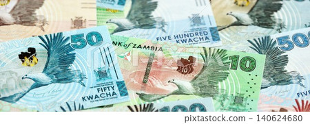 Zambian kwacha money bills pile on table. Zambia banknotes of ZMW currency close up Zambian kwacha money bills pile on table. Zambia banknotes of ZMW currency close up 140624680