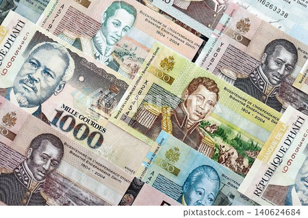 Haitian gourde money bills pile on table. Haiti banknotes of HTG currency. Concept of business Haitian gourde money bills pile on table. Haiti banknotes of HTG currency. Concept of business 140624684