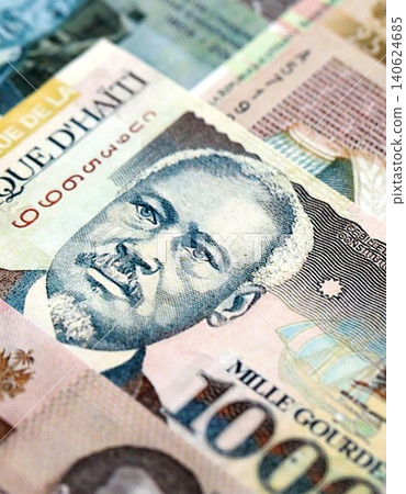 Haitian gourde money bills pile on table. Haiti banknotes of HTG currency. Concept of business Haitian gourde money bills pile on table. Haiti banknotes of HTG currency. Concept of business 140624685