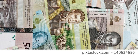 Haitian gourde money bills pile on table. Haiti banknotes of HTG currency. Concept of business Haitian gourde money bills pile on table. Haiti banknotes of HTG currency. Concept of business 140624686