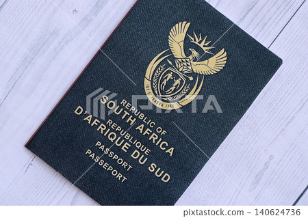 South African passport on table. Official identification document book for citizens of South Africa South African passport on table. Official identification document book for citizens of South Africa 140624736