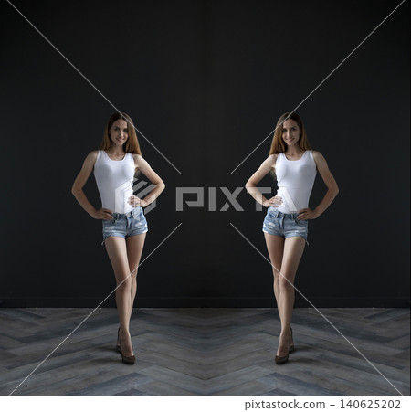 young beautiful woman on a dark background, full length studio shot 140625202