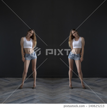 young beautiful woman on a dark background, full length studio shot 140625213