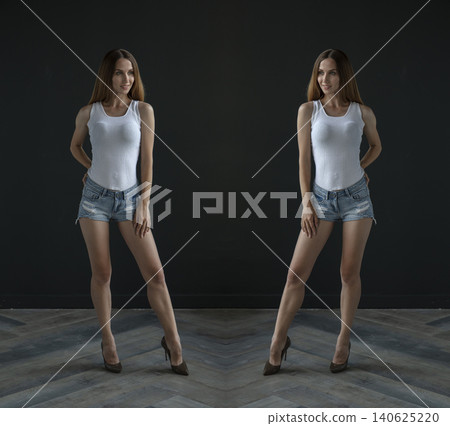 young beautiful woman on a dark background, full length studio shot 140625220