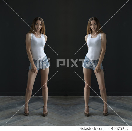 young beautiful woman on a dark background, full length studio shot 140625222