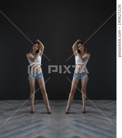 young beautiful woman on a dark background, full length studio shot 140625226