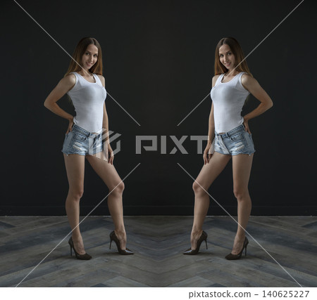young beautiful woman on a dark background, full length studio shot 140625227