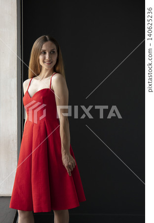 young beautiful woman on a dark background, full length studio shot 140625236
