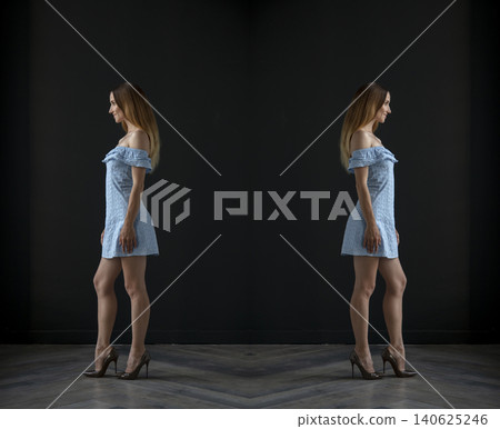 young beautiful woman on a dark background, full length studio shot 140625246