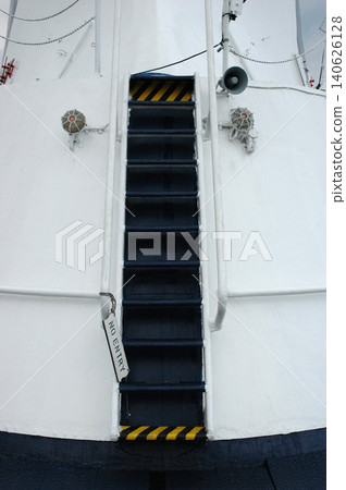 Steep metal stairs on a white ship deck with a no entry sign. Steep metal stairs on a white ship deck with a no entry sign. 140626128
