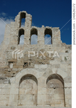 Ruined stone facade of Odeon of Herodes Atticus in Athens Greece 140626172