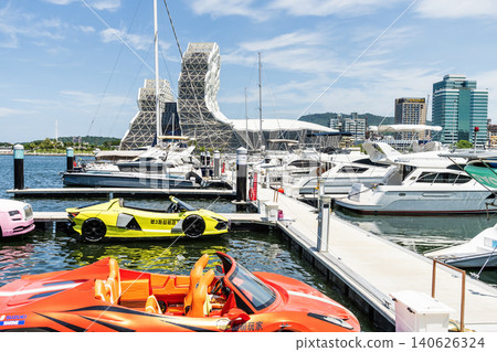 View of Argo Yacht Marina at Glory Pier of Kaohsiung Port, Taiwan, and the Kaohsiung Music Center building. View of Argo Yacht Marina at Glory Pier of Kaohsiung Port, Taiwan, and the Kaohsiung Music Center building. 140626324