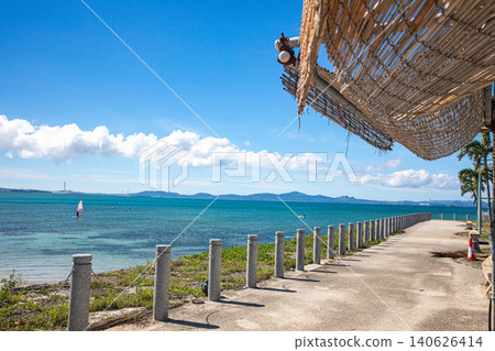 The coastal promenade of the Kaichu Road and the beautiful ocean, with the shade of bamboo blinds and the blue sky stretching out above. The coastal promenade of the Kaichu Road and the beautiful ocean, with the shade of bamboo blinds and the blue sky stretching out above. 140626414