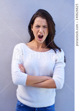 Studio, portrait and woman feeling offended, shocked and angry with emotion and confused by news. Blue background, female person and girl with question of why with arms crossed and surprised 140626625