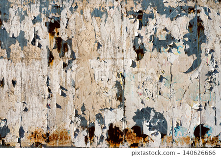 Abstract macro background of aged rusty wall with torn paper and peeling paint layers Abstract macro background of aged rusty wall with torn paper and peeling paint layers 140626666
