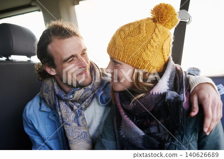 Couple, hug and happy together in car, travel and bonding with road trip for date or anniversary. Love, trust and commitment with partner, loyalty and cuddle for warmth in winter, vacation and smile 140626689