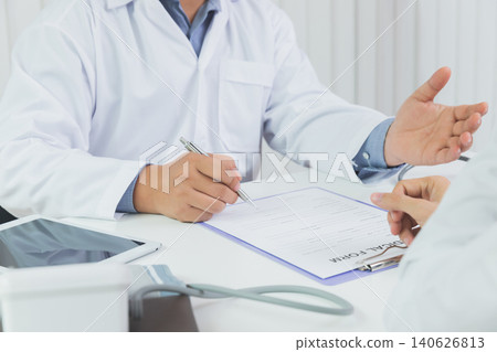 A doctor consulting and explain patient health check in office. Medicine and health care concept. A doctor consulting and explain patient health check in office. Medicine and health care concept. 140626813