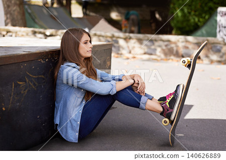 Fashion, thinking and woman with skateboard in city for exercise, training and skating in skate park. Skater, fitness and person in trendy, casual and street style for sports, fun hobby and relax Fashion, thinking and woman with skateboard in city for exercise, training and skating in skate park. Skater, fitness and person in trendy, casual and street style for sports, fun hobby and relax 140626889