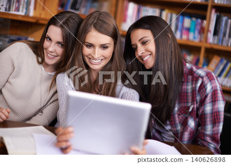 Happy women, learning and tablet selfie in library or bonding together for support as friends. Students, college and update a profile picture on social media, scholarship and solidarity education 140626898