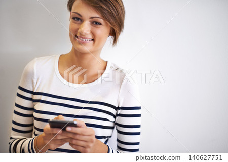 Teen, studio or portrait with smartphone, smile and face for social media or communication. Girl, phone and texting with technology, online connection or internet message isolated on white background Teen, studio or portrait with smartphone, smile and face for social media or communication. Girl, phone and texting with technology, online connection or internet message isolated on white background 140627751