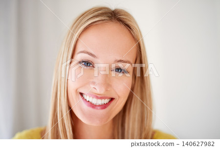 Happy, portrait and woman in a house with positive attitude, confidence and feel good mood on wall background. Face, smile and female person cheerful on vacation, holiday or day off in a living room Happy, portrait and woman in a house with positive attitude, confidence and feel good mood on wall background. Face, smile and female person cheerful on vacation, holiday or day off in a living room 140627982