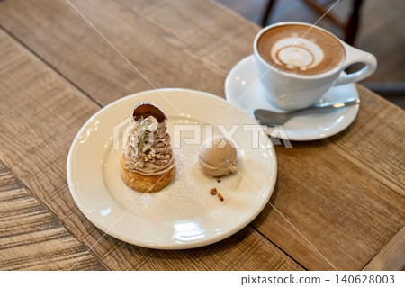 A café time with Mont Blanc tart and café latte. A café time with Mont Blanc tart and café latte. 140628003