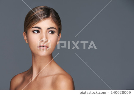Beauty, space and thinking with natural woman in studio isolated on grey background for wellness. Aesthetic, skincare and vision with confident young model on mockup for dermatology treatment Beauty, space and thinking with natural woman in studio isolated on grey background for wellness. Aesthetic, skincare and vision with confident young model on mockup for dermatology treatment 140628009