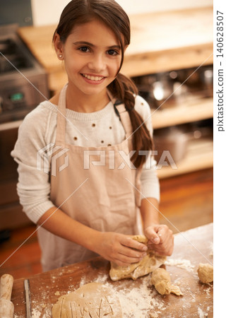 Girl, dough and baking portrait in kitchen, pastry and prepare flour mixture for cooking. Female person, kid and smile for learning in home, child development and education for cookie skill or cake 140628507