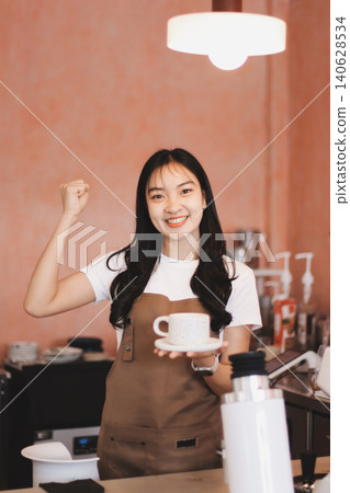 Young woman at barista school learning how to make espresso coffee. Young woman at barista school learning how to make espresso coffee. 140628534