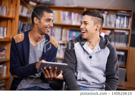 Students, library and funny joke on tablet, diversity and social media on break in college. Young, men and touchscreen and happy for collaboration on online project and browse internet meme to relax Students, library and funny joke on tablet, diversity and social media on break in college. Young, men and touchscreen and happy for collaboration on online project and browse internet meme to relax 140628610