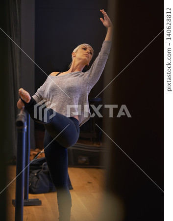 Ballet, posture and woman with leg stretch in dance studio for performance, show or theater rehearsal. Art, balance or lady dancer with stretching pole for ballroom, fitness or warm up stage training Ballet, posture and woman with leg stretch in dance studio for performance, show or theater rehearsal. Art, balance or lady dancer with stretching pole for ballroom, fitness or warm up stage training 140628812