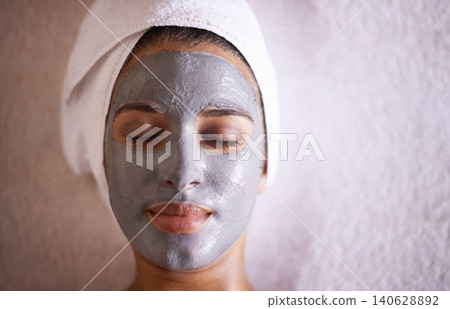 Woman, mask and facial in spa for skincare, beauty and cosmetic treatment for break or peace. Young person and natural for holistic therapy for wellness, clean and hygiene with product for peel Woman, mask and facial in spa for skincare, beauty and cosmetic treatment for break or peace. Young person and natural for holistic therapy for wellness, clean and hygiene with product for peel 140628892