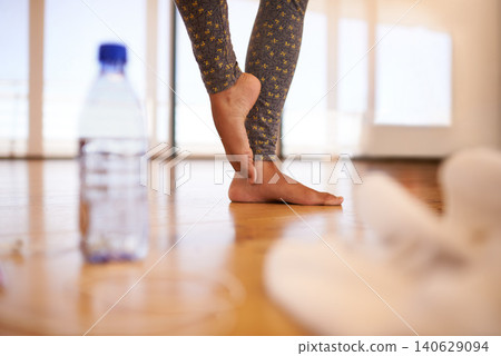 Ballet, closeup or feet in dance studio for fitness, training or artistic theatre rehearsal with water. Art, toes or person zoom at center for ballroom, practice or steps of freedom with sports drink 140629094