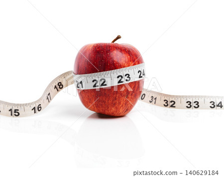 Apple, wellness and tape measure with red fruit in studio isolated on white background for diet, health or nutrition. Sustainability, vitamins and size with organic produce for detox or weightloss Apple, wellness and tape measure with red fruit in studio isolated on white background for diet, health or nutrition. Sustainability, vitamins and size with organic produce for detox or weightloss 140629184