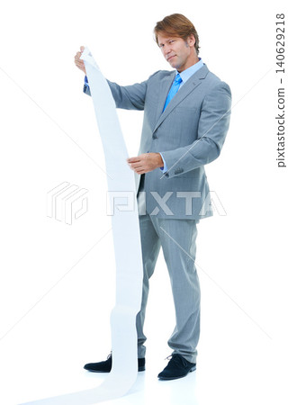 Businessman, portrait and receipt with finance, bills or expenses on a white studio background. Man or employee with paperwork or document for financial record, debt or budget list on mockup space Businessman, portrait and receipt with finance, bills or expenses on a white studio background. Man or employee with paperwork or document for financial record, debt or budget list on mockup space 140629218