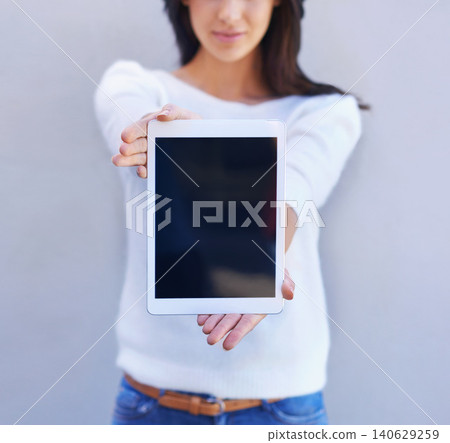 Tablet, show and hands of woman in studio background, smile and happiness for mobile and media. Presentation, female person and girl with digital device, mockup and screen of technology and internet Tablet, show and hands of woman in studio background, smile and happiness for mobile and media. Presentation, female person and girl with digital device, mockup and screen of technology and internet 140629259