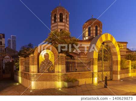 Holy Trinity Cathedral with illuminated facade, entrance gate and evening sky in Batumi, Georgia. Holy Trinity Cathedral with illuminated facade, entrance gate and evening sky in Batumi, Georgia. 140629873