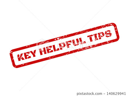 An isolated red textured rubber stamp displaying Key Helpful Tips for important guidance 140629941