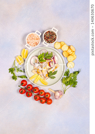 Herring fillets on plate with lemon onion mustard Herring fillets on plate with lemon onion mustard 140630670