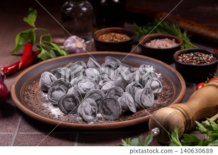 Black dumplings on plate with spices and herbs Black dumplings on plate with spices and herbs 140630689